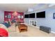 Cozy basement with multiple screens for entertainment and comfortable seating at 1952 Combine Cir, Apex, NC 27502