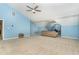 View of a well-lit bedroom with a ceiling fan and vaulted ceilings, providing ample space and a comfortable atmosphere at 1952 Combine Cir, Apex, NC 27502