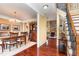Open-concept entryway showcasing a dining room, staircase, and a glimpse of the living room with fireplace at 1952 Combine Cir, Apex, NC 27502
