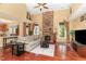 Spacious living room with a stone fireplace, high ceilings, and an abundance of natural light at 1952 Combine Cir, Apex, NC 27502