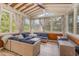 Bright sunroom with floor-to-ceiling windows, a vaulted ceiling, and comfortable seating at 1952 Combine Cir, Apex, NC 27502