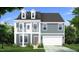 Charming two-story home with gray siding, dormer windows, balcony, well-manicured lawn, and an attached two-car garage at 199 Sugar Pine Drive, Franklinton, NC 27525