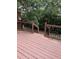 Private wooden deck surrounded by lush greenery, perfect for outdoor relaxation at 210 Standish Dr Dr, Chapel Hill, NC 27517