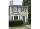 Charming townhome with blue shutters, bay window, and well-maintained landscaping at 210 Standish Dr Dr, Chapel Hill, NC 27517