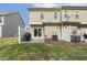 Private backyard with patio, grassy area, and partial fencing; perfect for outdoor living at 223 Morgan Brook Way, Rolesville, NC 27571