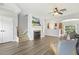 Inviting living room featuring a fireplace, hardwood floors, and an open layout at 223 Morgan Brook Way, Rolesville, NC 27571