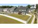 Fenced backyard featuring a well-kept lawn and a two-story home with a deck at 236 Artisan Park Dr, Wake Forest, NC 27587