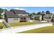 Two-story home with a fenced backyard, a well-maintained lawn, and a deck at 236 Artisan Park Dr, Wake Forest, NC 27587