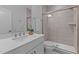 Modern bathroom featuring a glass-enclosed shower with gray tiling, a white vanity and quartz countertop at 236 Artisan Park Dr, Wake Forest, NC 27587
