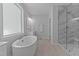 Bright bathroom featuring soaking tub and large shower at 236 Artisan Park Dr, Wake Forest, NC 27587
