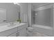 Bright bathroom featuring shower and tub at 236 Artisan Park Dr, Wake Forest, NC 27587