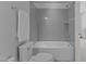 Bathroom featuring a tub and shower with gray tile, plus a chrome shower head at 236 Artisan Park Dr, Wake Forest, NC 27587