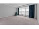 Large bedroom with plush carpet, recessed lighting, and natural light streaming through the window at 236 Artisan Park Dr, Wake Forest, NC 27587