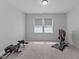 Bright bedroom with two large windows and space for exercise equipment at 236 Artisan Park Dr, Wake Forest, NC 27587