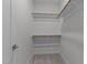 Walk-in closet with carpeted floor and racks and shelving for storage at 236 Artisan Park Dr, Wake Forest, NC 27587