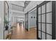Grand foyer features tall ceilings, elegant barn doors, and a view of the open-concept living spaces at 236 Artisan Park Dr, Wake Forest, NC 27587