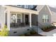Cozy front porch with seating, offering a welcoming entrance to the home with great curb appeal at 236 Artisan Park Dr, Wake Forest, NC 27587