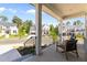 Inviting front porch features comfortable seating and provides a charming view of the neighborhood at 236 Artisan Park Dr, Wake Forest, NC 27587