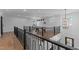 Upstairs game room with a pool table and modern lighting fixtures for a sophisticated space at 236 Artisan Park Dr, Wake Forest, NC 27587