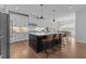 Beautiful kitchen featuring a large island with seating, pendant lights, and modern appliances at 236 Artisan Park Dr, Wake Forest, NC 27587