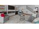 Cozy living room featuring a fireplace with marble surround, built-ins, and stylish furniture at 236 Artisan Park Dr, Wake Forest, NC 27587