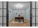 Stylish home office with a modern light fixture, light blue walls and plenty of space to work at 236 Artisan Park Dr, Wake Forest, NC 27587