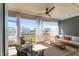 Relaxing screened-in porch with comfortable seating and views of the neighborhood at 236 Artisan Park Dr, Wake Forest, NC 27587