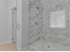 Walk-in shower featuring tile surround and glass door at 236 Artisan Park Dr, Wake Forest, NC 27587