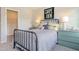 Charming bedroom with an iron bed frame, and a 'Carpe Diem' sign adds a touch of character at 24 Grove Township Way, Angier, NC 27501