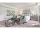 Bright main bedroom with a comfortable bed, cozy chairs, and stylish decor creating a relaxed atmosphere at 24 Grove Township Way, Angier, NC 27501