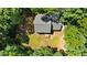 Aerial perspective of home with spacious yard, deck, and convenient driveway access at 25 Ballinger Dr, Youngsville, NC 27596