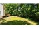 Expansive backyard with a wooden deck, perfect for outdoor gatherings and enjoying nature at 25 Ballinger Dr, Youngsville, NC 27596