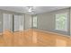 Large bedroom with hardwood flooring, ensuite bathroom, and natural light at 25 Ballinger Dr, Youngsville, NC 27596