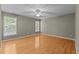 Spacious bedroom with hardwood floors, ceiling fan, and natural light at 25 Ballinger Dr, Youngsville, NC 27596