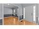 Welcoming foyer featuring hardwood floors, fresh paint, and sidelights surrounding the front door at 25 Ballinger Dr, Youngsville, NC 27596