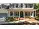 Charming front porch with classic columns and brick accents, a perfect spot for relaxing at 25 Ballinger Dr, Youngsville, NC 27596