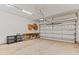 Spacious two-car garage with storage, shelving and painted walls at 25 Ballinger Dr, Youngsville, NC 27596