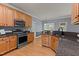 Updated kitchen with stainless steel appliances and granite countertops at 25 Ballinger Dr, Youngsville, NC 27596