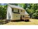 Back exterior view featuring a wooden deck and access to the spacious backyard at 25 Ballinger Dr, Youngsville, NC 27596