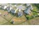 An aerial view of a home featuring a fenced yard with play set and a small storage shed in a cul-de-sac community at 25 Gallery Park Dr, Franklinton, NC 27525