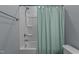 Bathroom featuring a shower-tub combination with a shower head and a decorative shower curtain at 25 Gallery Park Dr, Franklinton, NC 27525