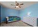 Bedroom featuring a daybed, dresser, large windows, and a ceiling fan at 25 Gallery Park Dr, Franklinton, NC 27525