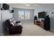 Comfortable bonus room features plush seating, large flat-screen TV, and surround sound speakers for entertainment at 25 Gallery Park Dr, Franklinton, NC 27525