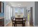 Bright dining area with natural light, table with seating, and a sliding glass door at 25 Gallery Park Dr, Franklinton, NC 27525