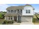 Charming two-story home with a blend of stone and siding accents, plus a two-car garage at 25 Gallery Park Dr, Franklinton, NC 27525