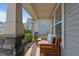 Close up view of the inviting front porch featuring a cozy bench and landscaping details at 25 Gallery Park Dr, Franklinton, NC 27525