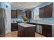 Modern kitchen featuring stainless steel appliances, an island, and countertops with light blue walls at 25 Gallery Park Dr, Franklinton, NC 27525