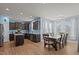 Open kitchen with dark cabinets, stainless appliances, an island, and a dining area at 25 Gallery Park Dr, Franklinton, NC 27525