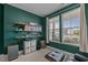 Inviting office space with built-in shelving, comfortable seating, and natural light from a bright window at 25 Gallery Park Dr, Franklinton, NC 27525