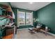 Stylish office features a comfortable Eames chair, modern lighting, and custom shelving for organized storage at 25 Gallery Park Dr, Franklinton, NC 27525